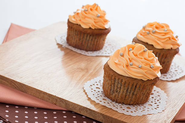 Homemade cupcakes served on kitchen table. stock photo