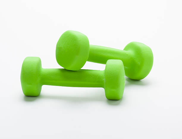 istock small green dumbbells,  isolated in white 186091342