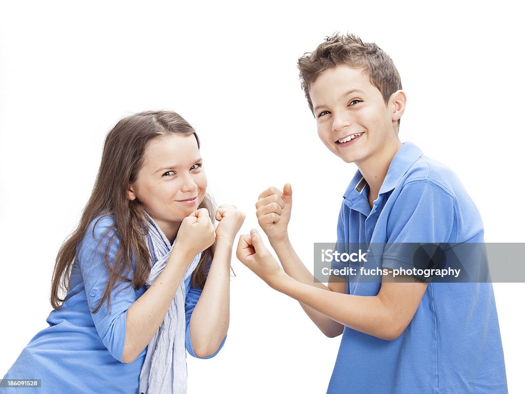 Brother and Sister fighting Brother and Sister in a playful fight Beautiful People Stock Photo