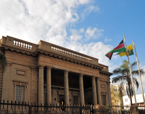 Nairobi, Kenya: neo-classical facade of the McMillan Memorial Library - Banda Street - flags of Kenya and Nairobi - photo by M.Torres