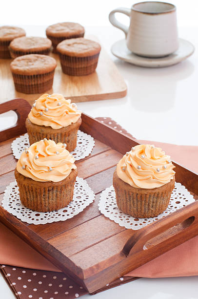 Homemade cupcakes served on kitchen table. stock photo