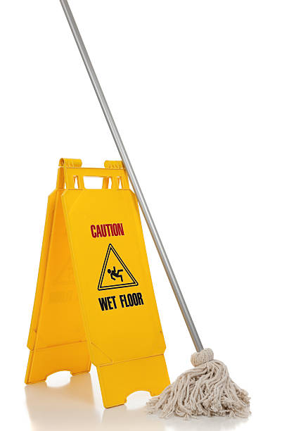 istock Wet floor sign and mop on white background 186095934