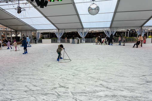 The Hague, Netherlands Nov 12, 2023 A child ice skates in a rink in the Scheveningen district.