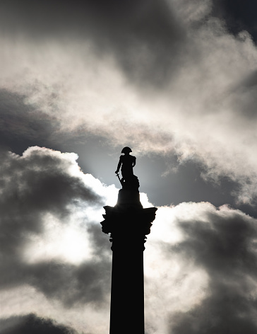 London, UK - Nov 01, 2023 -  Nelson's column silhouette with dramatic sky background in front of National Gallery building. View of the iconic Trafalgar Square in london, Space for text, Selective focus.