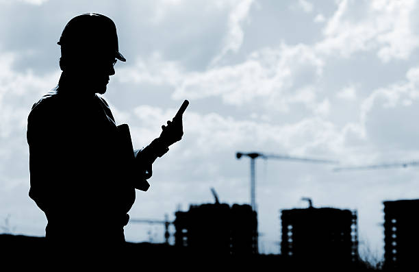 Engineer and cellphone. stock photo