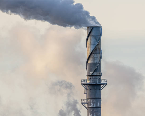 Metal smokestack belching smoke