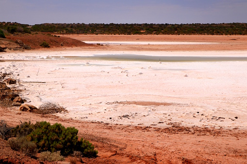Salt deposits show in this dried out lake bed at Eucolo Creek in the arid landscape of the Australian Outback