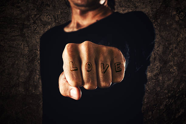istock Love tattoo. Hand with clenched fist 186100558