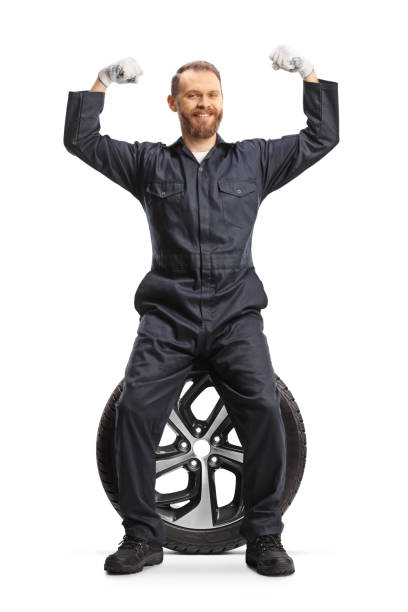 istock Strong car mechanic sitting on a tire 1861010852