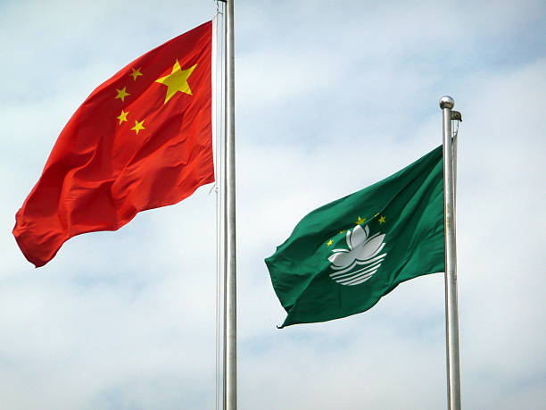 istock Flag of China and Macau blowing in the wind 186101329