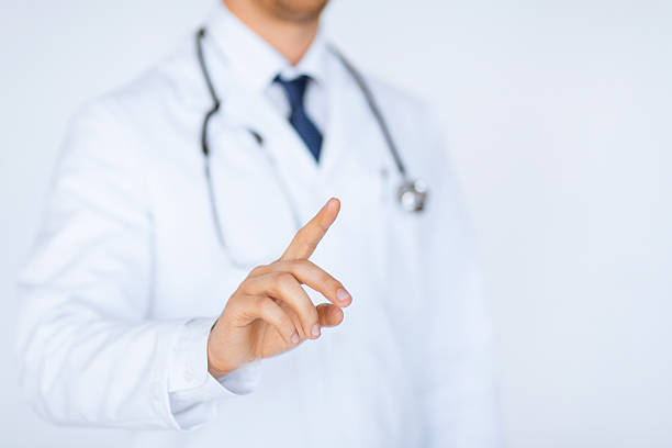 istock doctor pointing finger to something 186102887