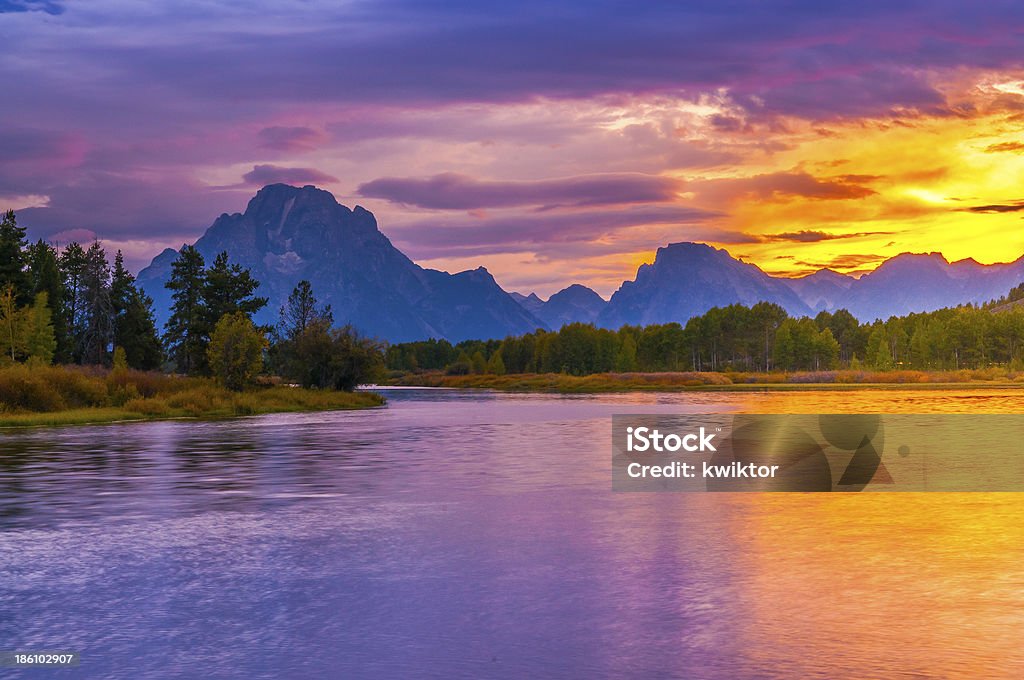 Beautiful Sunset at Grant Tetons Amazing Sunset over Grand Tetons taken from the Oxbow Bend Turnout Animal Wildlife Stock Photo