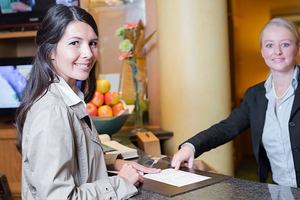 istock Smiling female guest in a hotel lobby 186103051