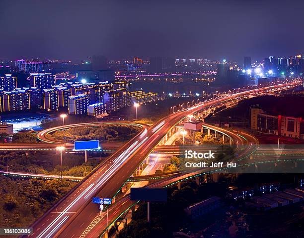 Freeway In Night With Cars Light At Modern City Stock Photo - Download Image Now - Bridge - Built Structure, Built Structure, Bus