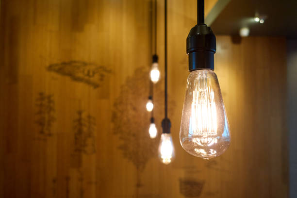 istock Row of filament light bulbs glowing indoors 1861032823