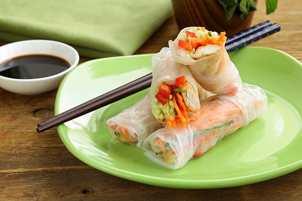 istock spring rolls with vegetables and chicken on a plate 186103329
