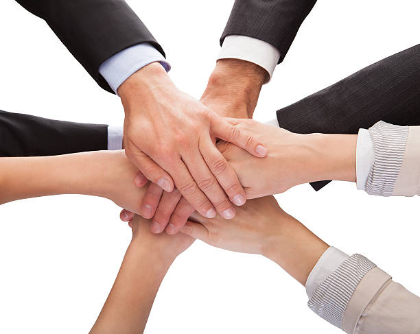 istock Businesspeople Stacking Their Hands Together 186104072