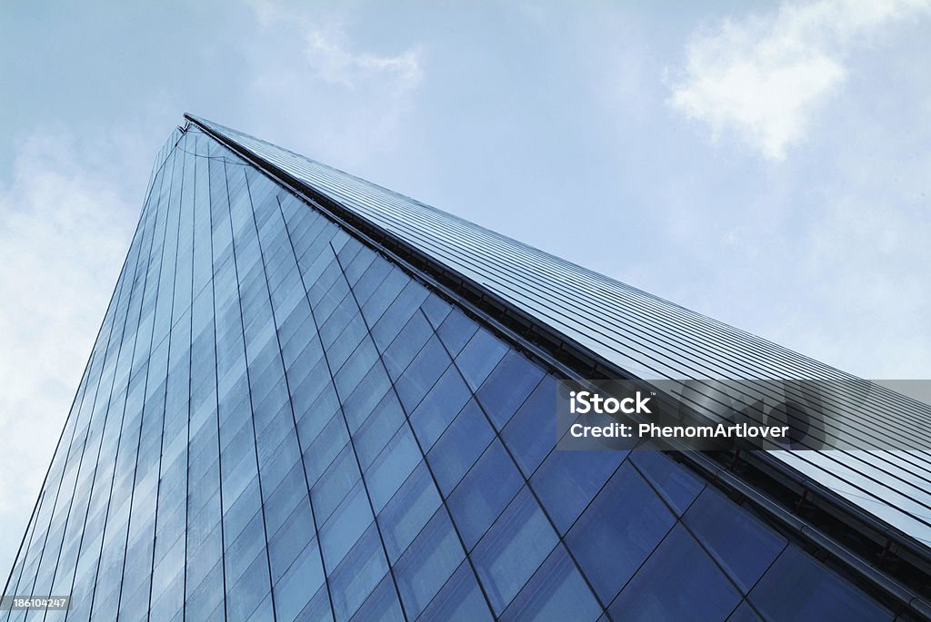 The Shard of Glass he Shard towering over London, photographed in London, UK, on 14th July 2013. Built in 2012 and standing 306 meters tall, the Shard is currently the tallest building in the European Union and a new London attraction. Shard London Bridge Stock Photo