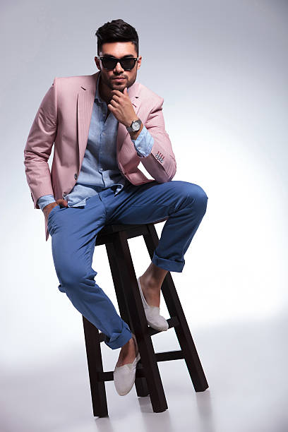 istock seated casual man with hand at chin 186104625