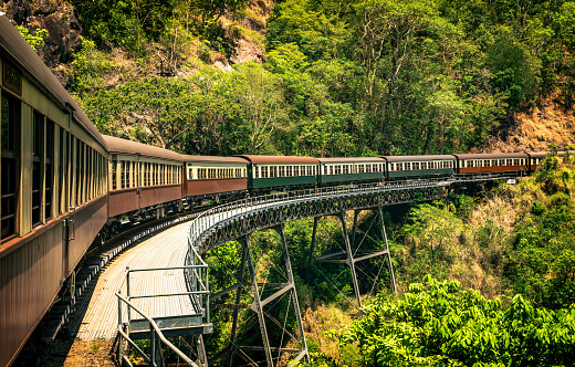 The view of the vintage train running across the viaduct in Kuranda Scenic Railway