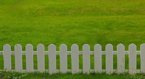 istock wooden fence in the grass. 186104925