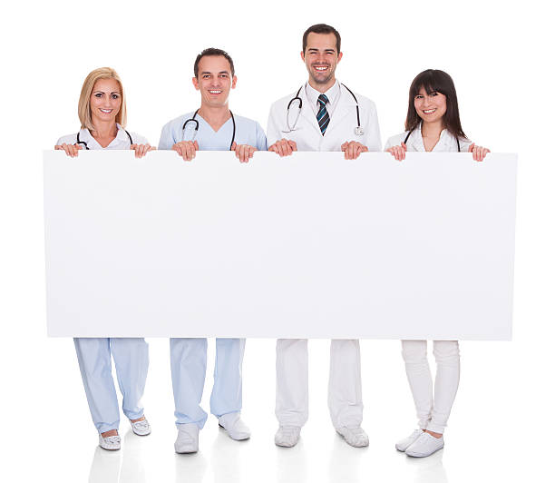 istock Group Of Doctors With Placard 186105317