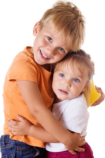 istock Brother and little sister hugging 186105703