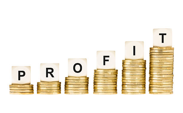 istock Word PROFIT on Gold Coin Stacks Isolated White 186105965