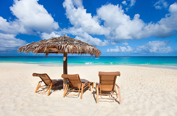 istock Chairs and umbrella on tropical beach 186106125