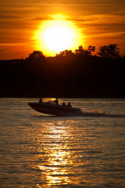 Speedboat at sunset stock photo