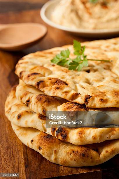 Homemade Indian Naan Flatbread Stock Photo - Download Image Now - Baked, Bread, Cilantro