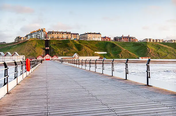 Looking to Saltburn by the Sea along Saltburn pier at sunrise in Yorkshire