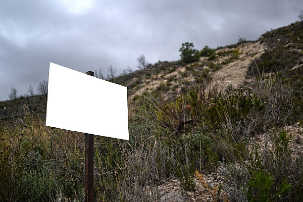 istock Blank board/sign on natural vegetation. Just add your text. 186109195