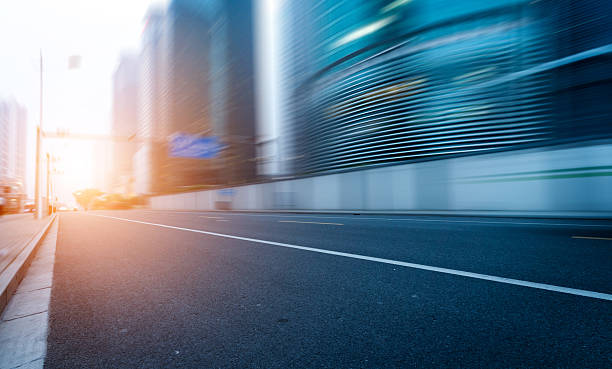 istock road in city with sunset 186109518