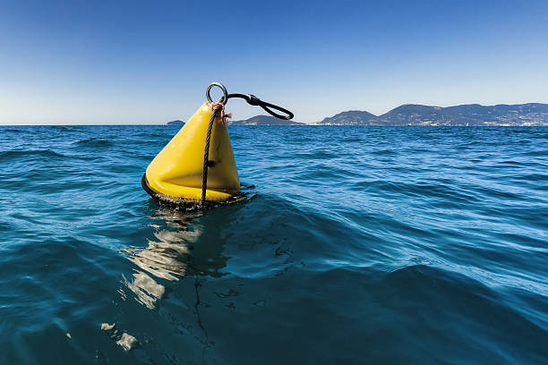 yellow sea buoy stock photo