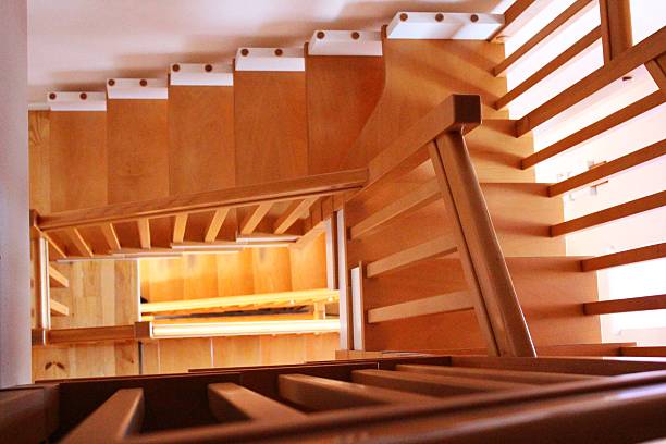 istock Long wooden oak staircase labyrinth 186109718
