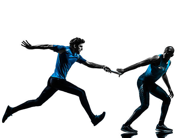 man relay runner sprinter silhouette two men relay running sprinting in silhouette studio on white background relay photos stock pictures, royalty-free photos & images
