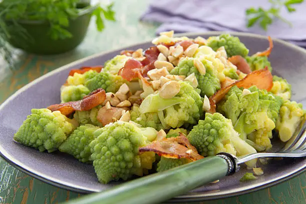 Romanesco cabbage salad with bacon and nuts.