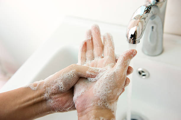 washing hand Washing of hands with soap under running water. hygiene stock pictures, royalty-free photos & images