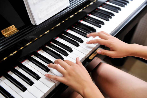 istock Woman playing piano 1861129520