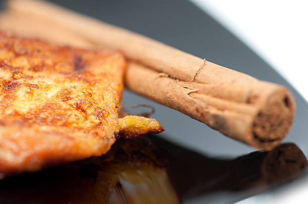 istock French toast, torrijas, and cinnamon stick on a black plate 186112956