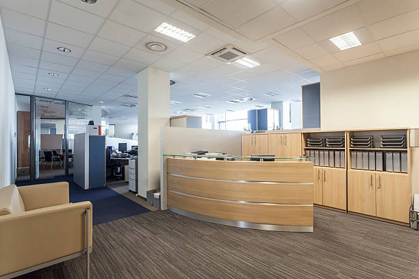 istock Modern office reception with curved wooden desk 186113175