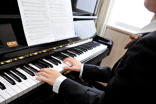 woman playing piano