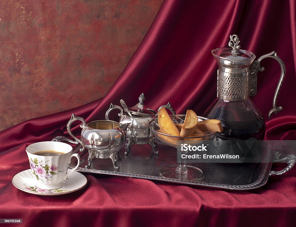 Composition with cup of coffee and biscotti. Composition with cup of coffee and biscotti over red silk drape. Baked Stock Photo