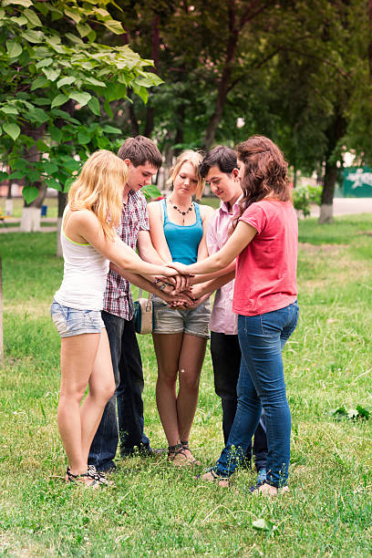 istock Group of happy smiling Teenage Students 186115548