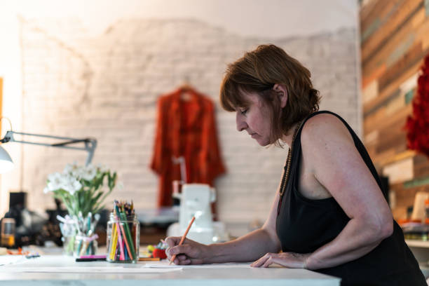 istock A fashion designer drawing a Vertical shot. Copy space 1861175677
