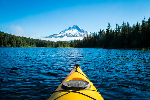 Kayak in mountain lake, Mt. Hood, Oregon Kayak in Trillium lake, Mt. Hood, Oregon pacific northwest stock pictures, royalty-free photos & images