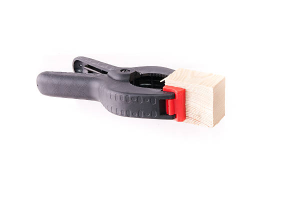 istock Black plastic A-clamp with wooden brick 186123344