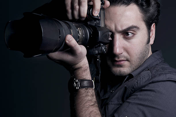 istock Photographer Portrait with a professional DSLR 186123360