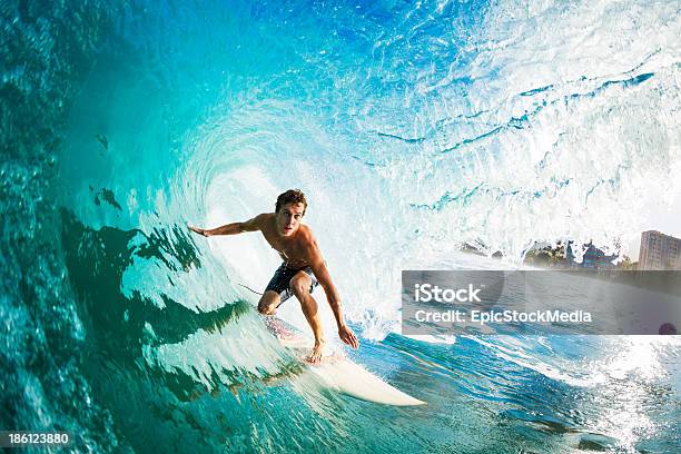 Closeup Of A Surfer Riding A Large Blue Wave Stock Photo - Download Image Now - Surfing, Breaking Wave, Men